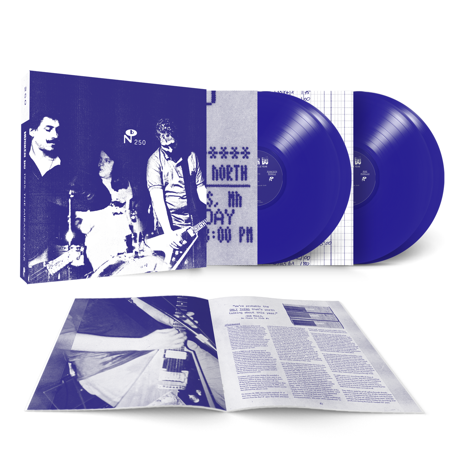1985: The Miracle Year vinyl double LP with blue records, band photo cover, and detailed booklet displayed open.