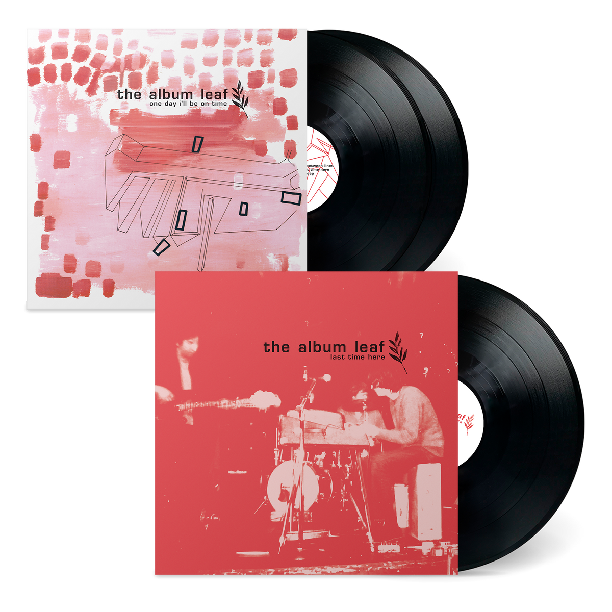 Two vinyl records with red and pink album covers featuring artistic designs.