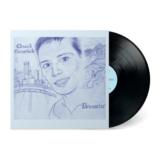 Dreamin' vinyl record featuring hand-drawn portrait and cityscape on light blue cover art by Chuck Senrick
