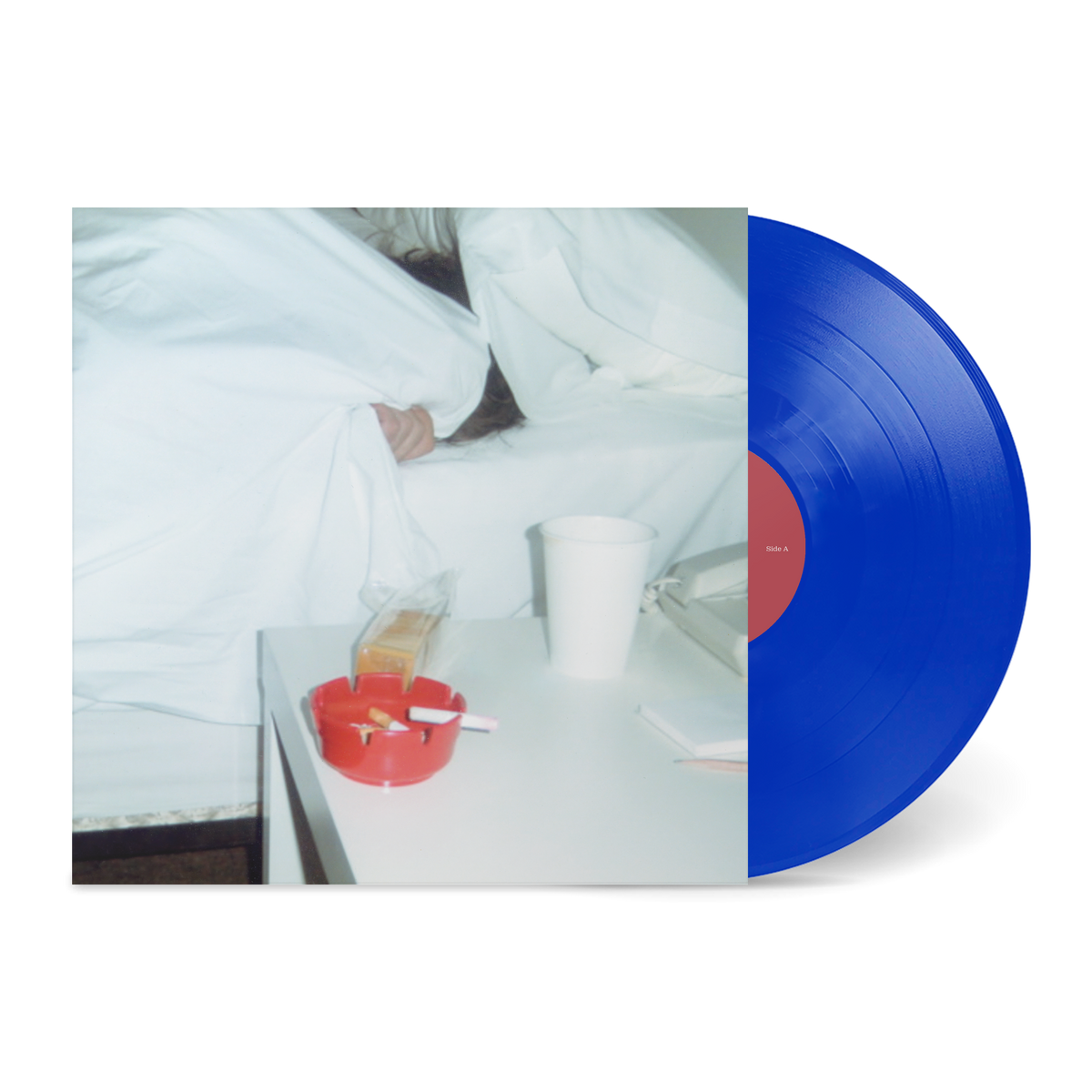 Blue vinyl record partially slipped out from an album cover showing a person hiding under white sheets, titled Together.