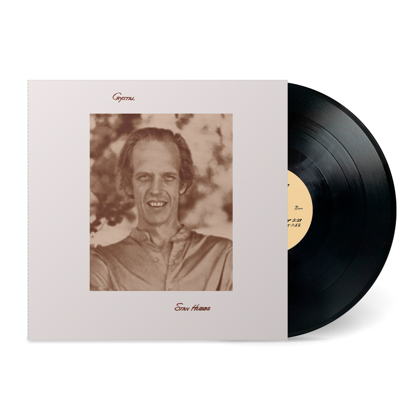 Vinyl record partially out of Crystal album cover featuring a sepia-toned portrait of a smiling man outdoors