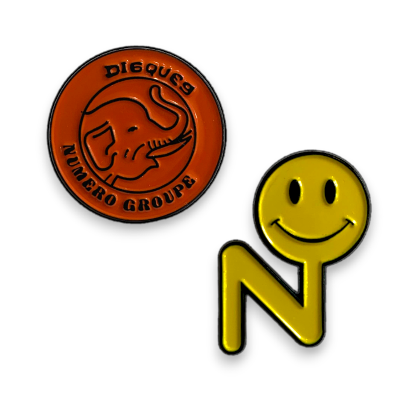 Numero Pin Pack featuring an orange vinyl record logo pin and a yellow smiley face N-shaped pin on black background