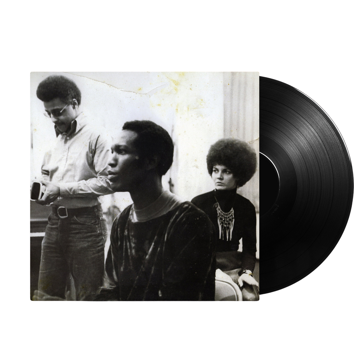 Black and white photo of three people with afro hairstyles on the cover of the vinyl record Telling The Truth