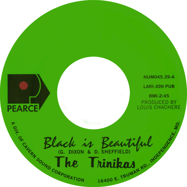 Close-up of a green vinyl record labeled Black Is Beautiful b/w Remember Me by The Trinikas on Pearce Records