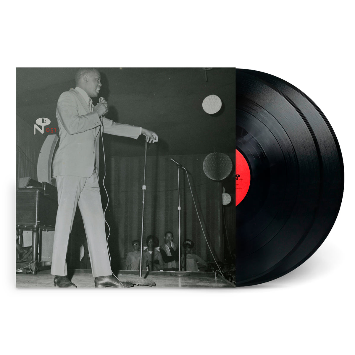 Black and white photo of a man singing on stage with microphone, vinyl record partially visible, Capitol City Soul