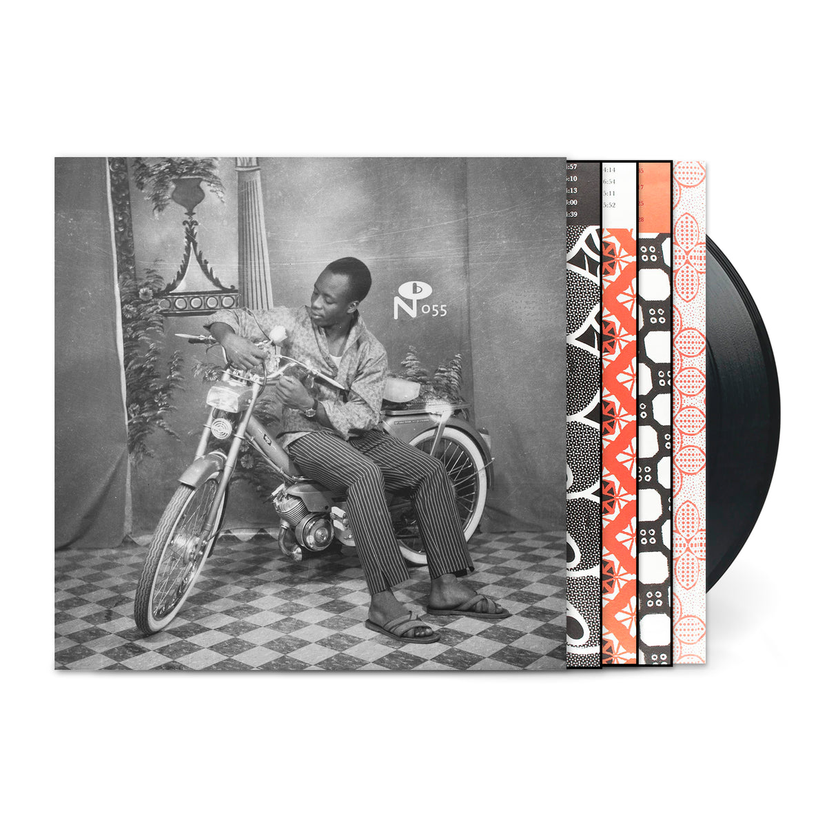 Vintage black and white photo of a man on a bicycle with vinyl records for Belle Époque in Upper Volta