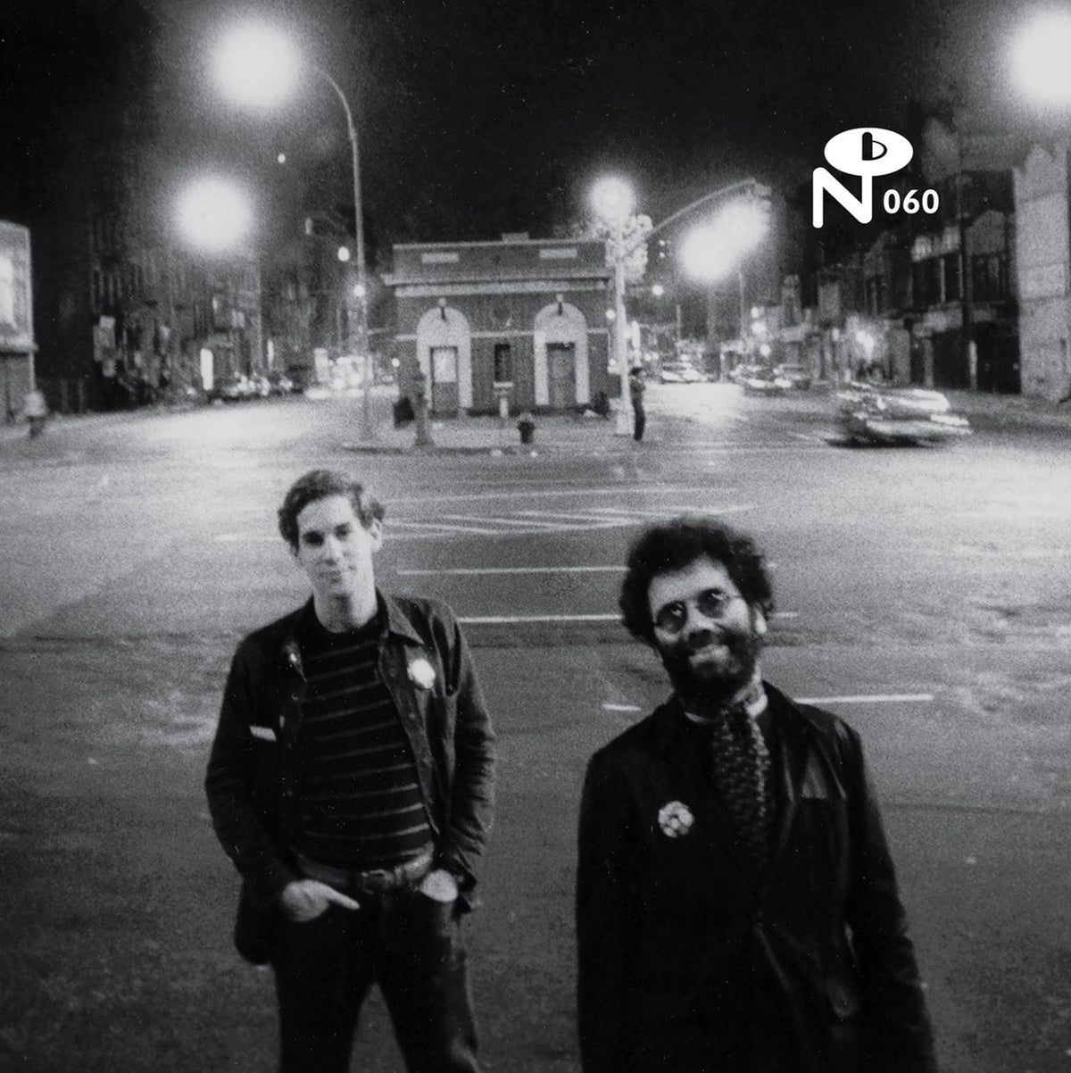 Black and white photo of two men standing on a quiet city street at night for New York, New York record cover