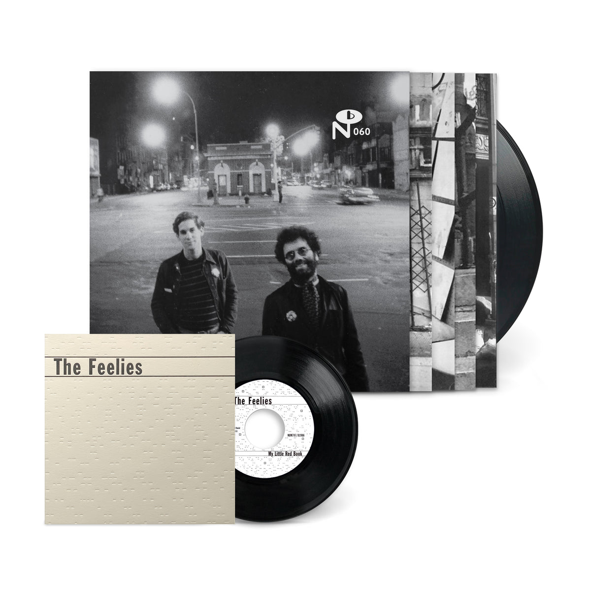 Black vinyl record with album cover featuring two men on a city street at night titled New York, New York