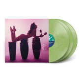 Vinyl record set with green translucent discs and cover showing a woman posing on conga drums for Rhum Rhapsodies & Other Exotic Delights