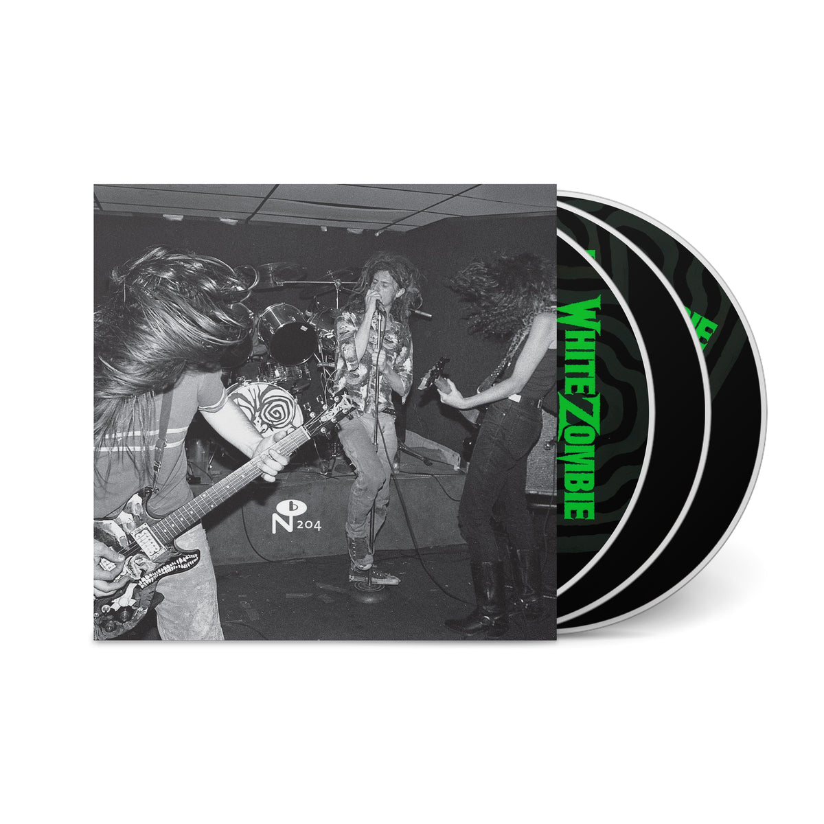 Black and white image of a live band performance on the cover of It Came From N.Y.C. with CDs showing White Zombie text