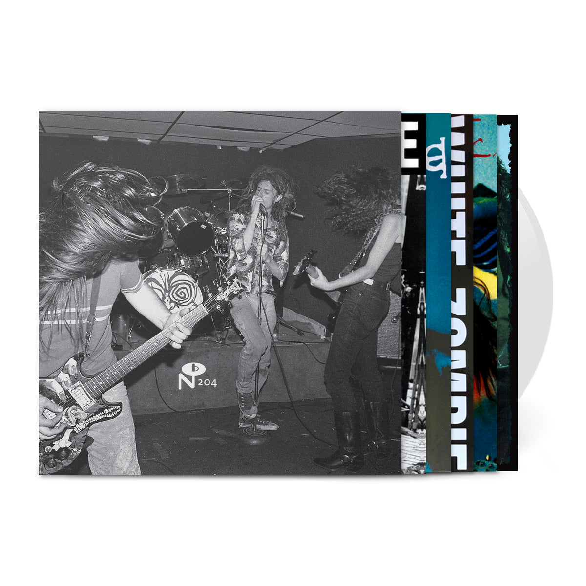 Black and white photo of a live punk band performing with three records behind titled It Came From N.Y.C.