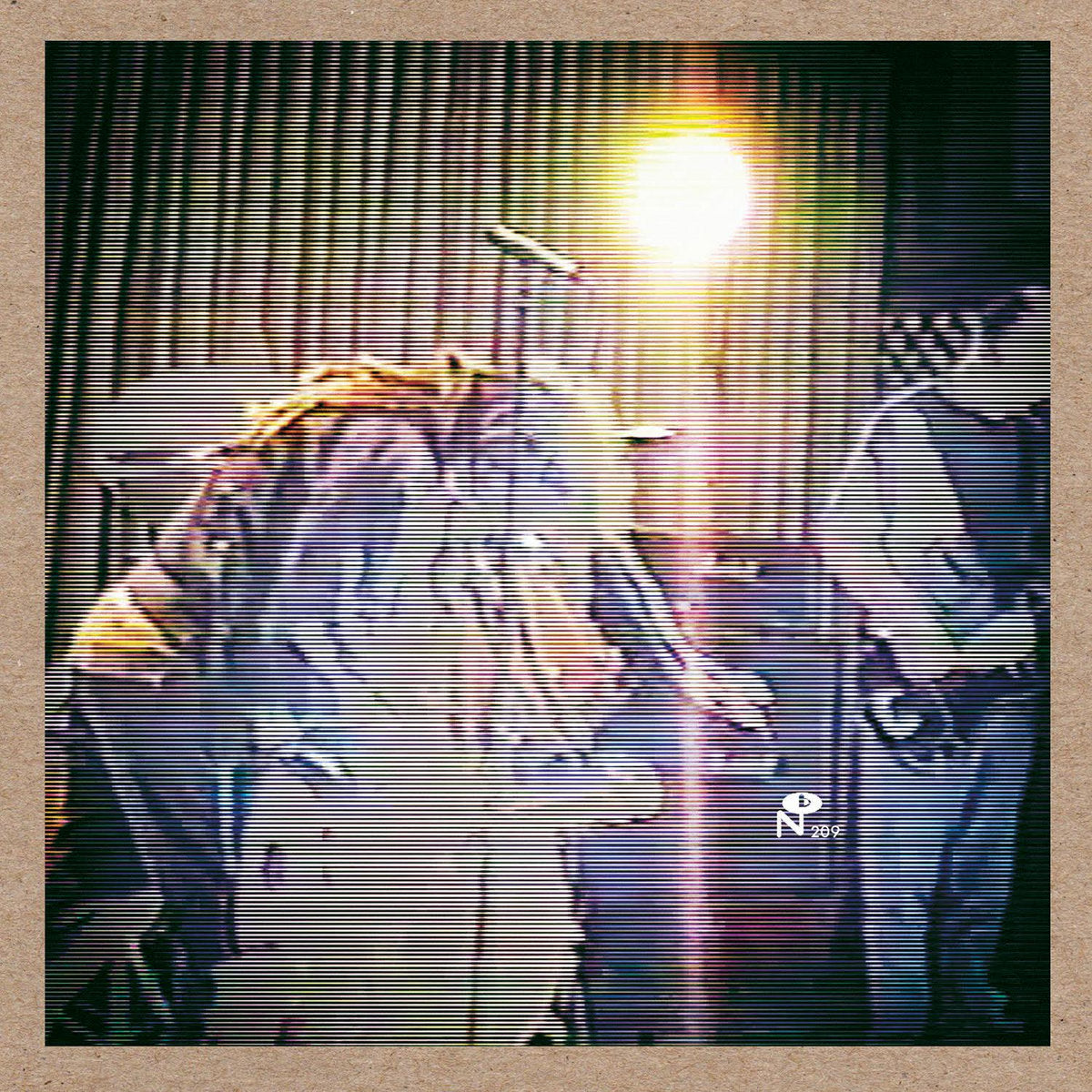 Grainy live band photo with bright light and microphone, highlighting Silent Dynamic Torture performance energy.