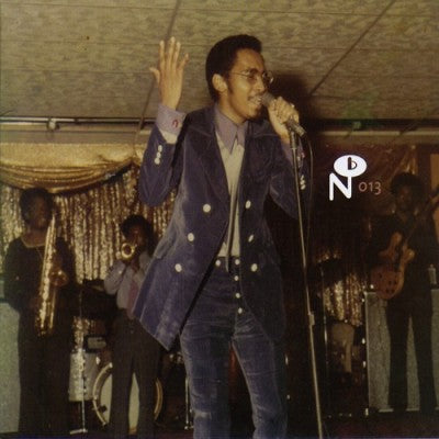 Vintage photo of a soulful singer performing live with band behind in Twinight's Lunar Rotation album art