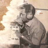 Vintage photo of a man adjusting audio equipment wearing headphones, featuring The Capsoul Label branding.