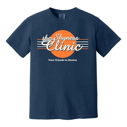 The Shyness Clinic T-Shirt in navy blue with orange circle and white retro text design on front