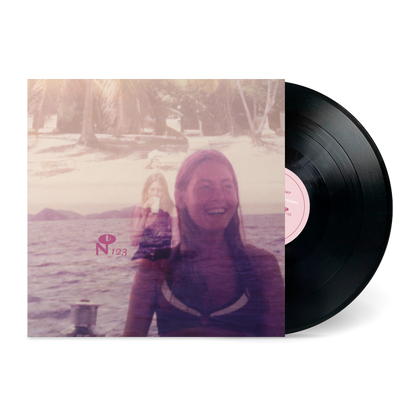 Vinyl record with cover featuring a smiling woman overlayed with a beach scene titled Lady Full Of Dreams