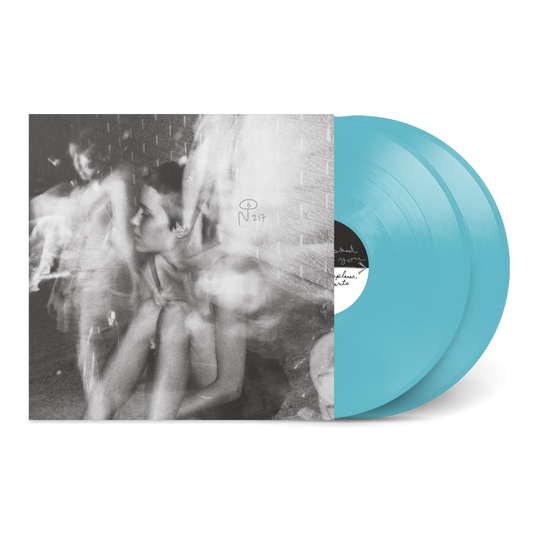 Black and white blurred photo on album cover with translucent blue vinyl records for Paper Airplanes, Paper Hearts