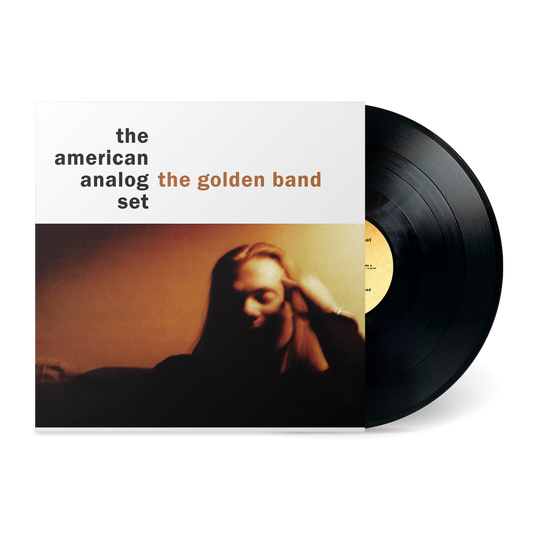 Vinyl record partially pulled from sleeve with blurred photo and text "the american analog set the golden band" on cover