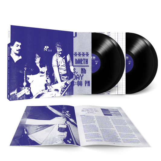 1985: The Miracle Year vinyl record set with blue-toned band photo cover and detailed booklet laid open