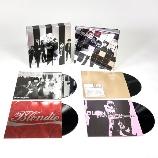 Record collection with vinyl albums displayed alongside the box set Against The Odds: 1974-1982