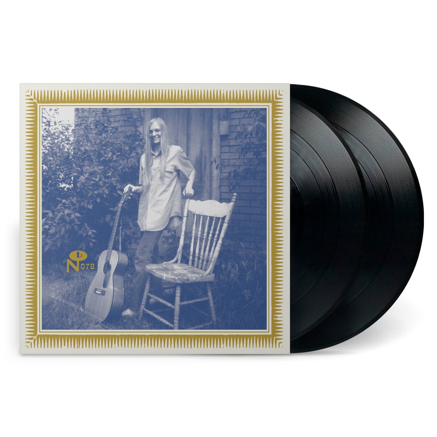 In Cuca Country vinyl record with vintage photo of woman standing by chair and acoustic guitar outdoors