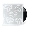 Black vinyl record partially inside a silver and white sleeve for Still Wanna Die b/w Take Me Home.
