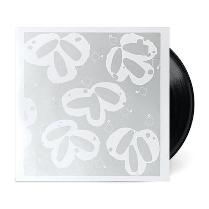 Black vinyl record partially inside a silver and white sleeve for Still Wanna Die b/w Take Me Home.