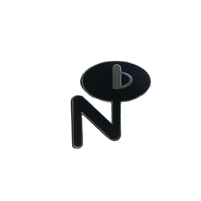 Black and silver enamel pin with abstract design featuring letter N and speech bubble shape labeled Enamel Pin