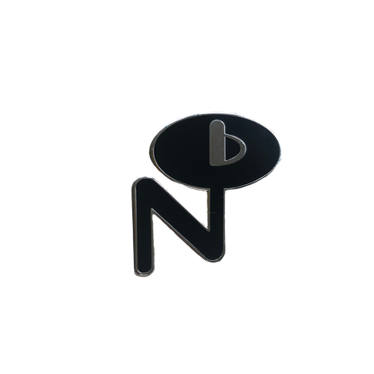 Black and silver enamel pin with abstract design featuring letter N and speech bubble shape labeled Enamel Pin
